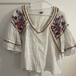White embroidered blouse by Anthropologie